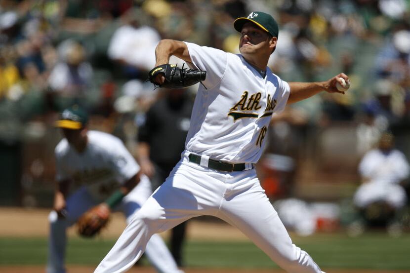 Oakland Athletics starting pitcher Rich Hill (18) throws against the Toronto Blue Jays...