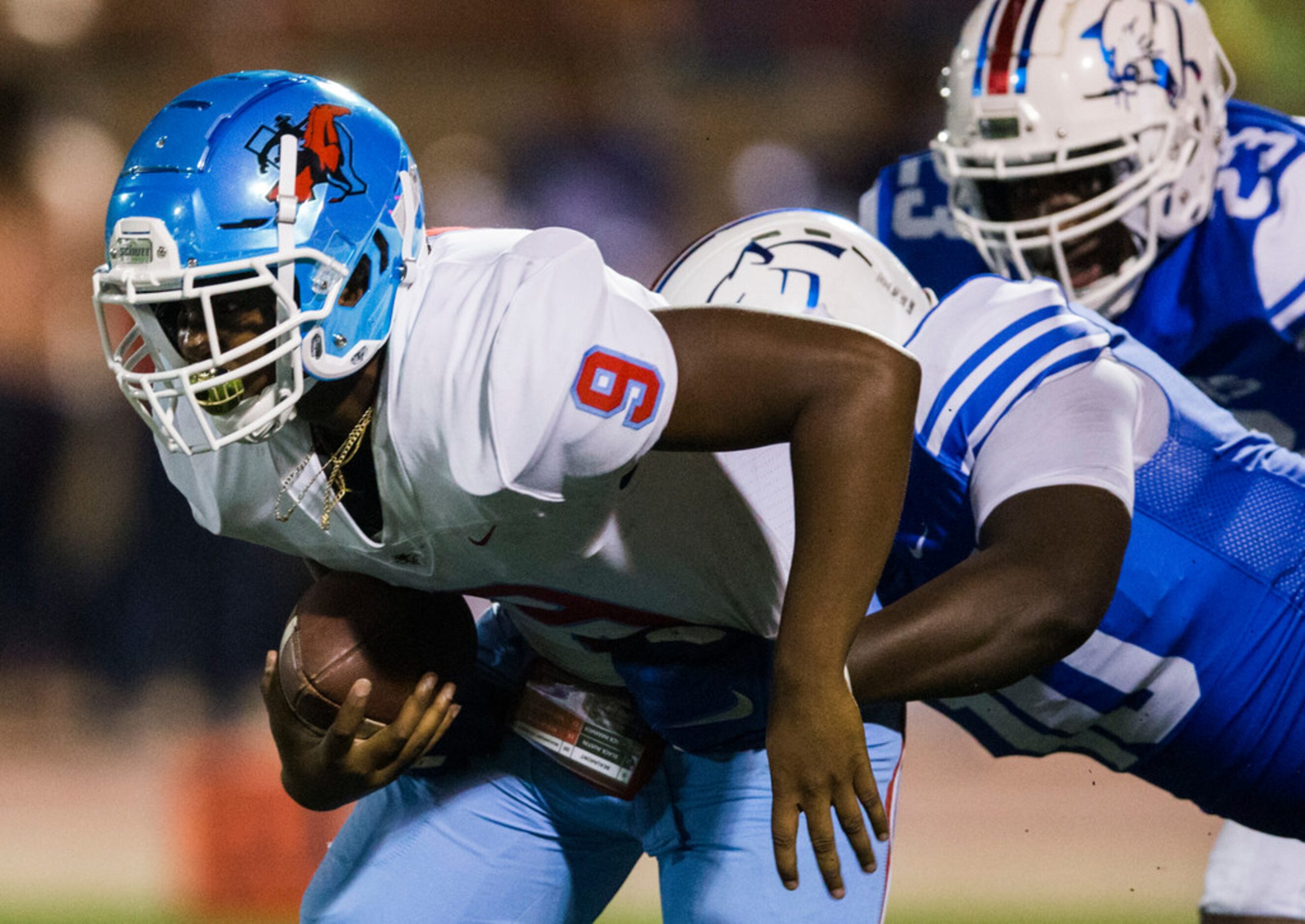 Skyline quarterback Darryl Richardson (9) is sacked by Duncanville defensive lineman Kevon...