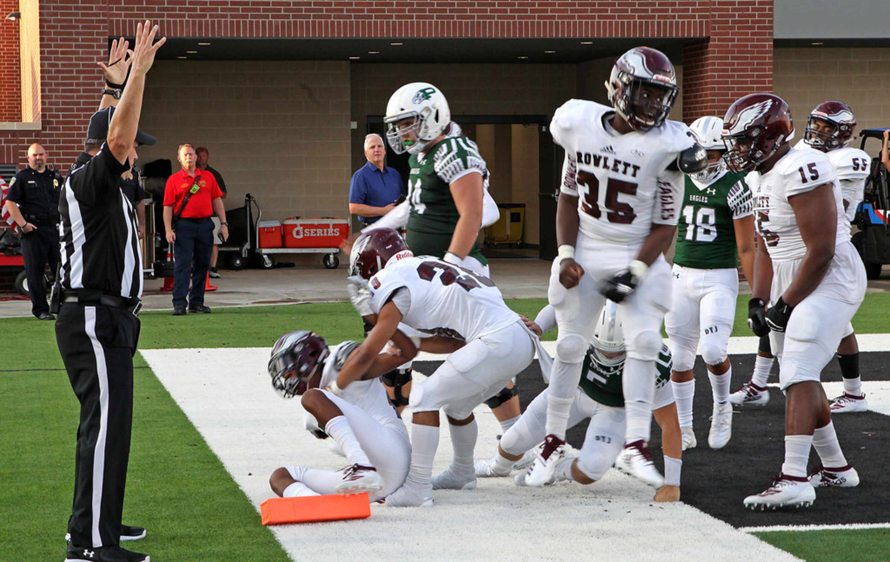 Rowlett High School defensive back Taiwan Edwards (20) scored the first touchdown at the new...