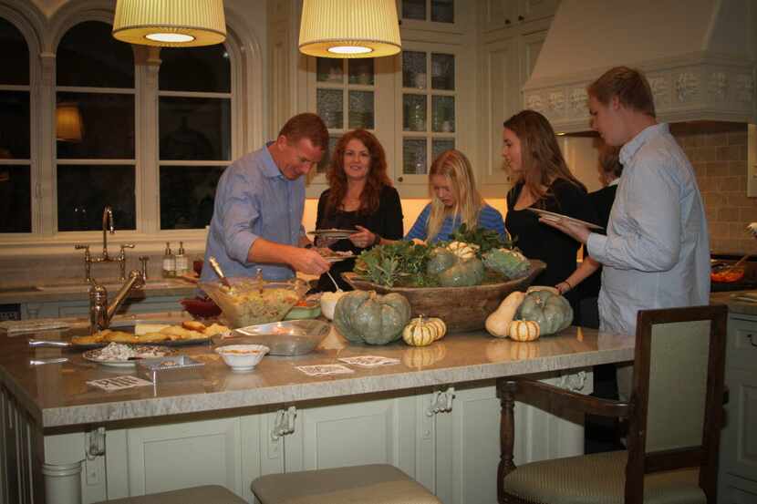 Cowboys coach Jason Garrett enjoys a Thanksgiving meal in 2013 at the Garrett household with...