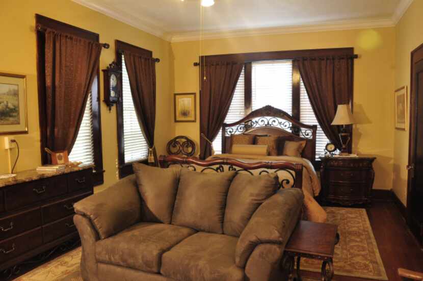  The Mansion on Sawmill Lake's Whippoorwill Suite features luxurious furnishings and a...