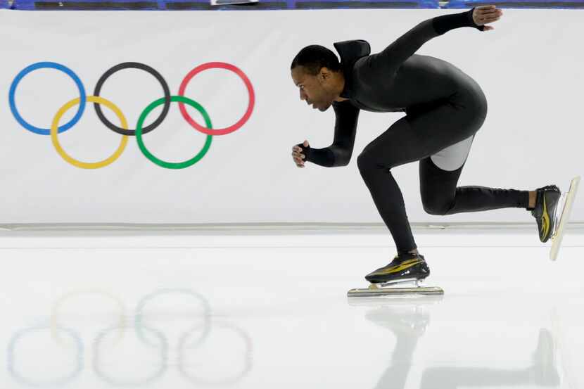 Shani Davis of the U.S. skates in the prototype of the official US Speedskating suit during...