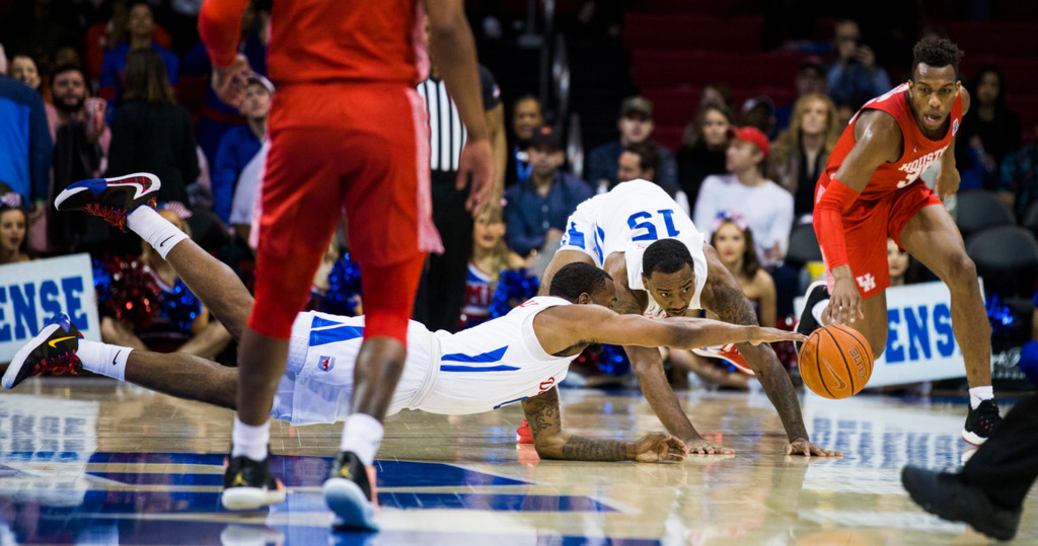 Southern Methodist Mustangs guard Tyson Jolly (0), forward Isiaha Mike (15) and Houston...