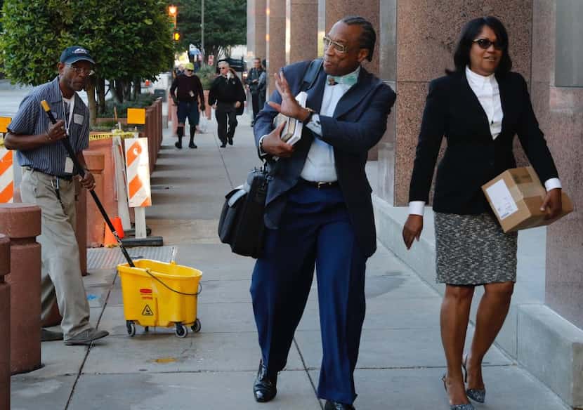 Dallas County Commissioner John Wiley Price, left, and co-defendant Dapheny Fain walk into...
