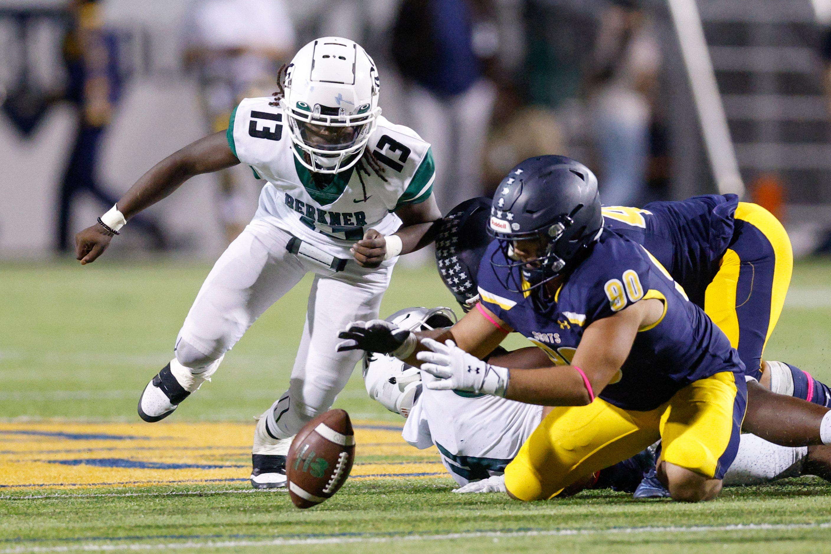 Highland Park defensive lineman Jonah Chahwan (90) recovers a snap fumbled by Richardson...