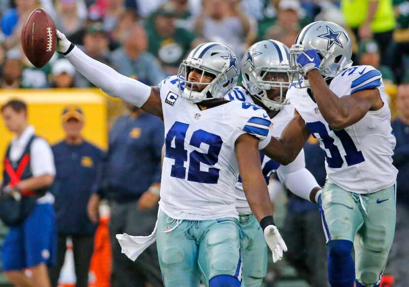 Dallas Cowboys strong safety Barry Church (42) celebrates his interception in the third...