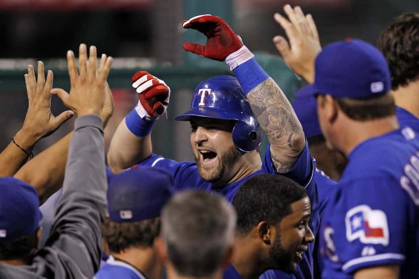 THE BEST OF THE RANGERS' MIKE NAPOLI: Texas Rangers' Mike Napoli is congratulated by...