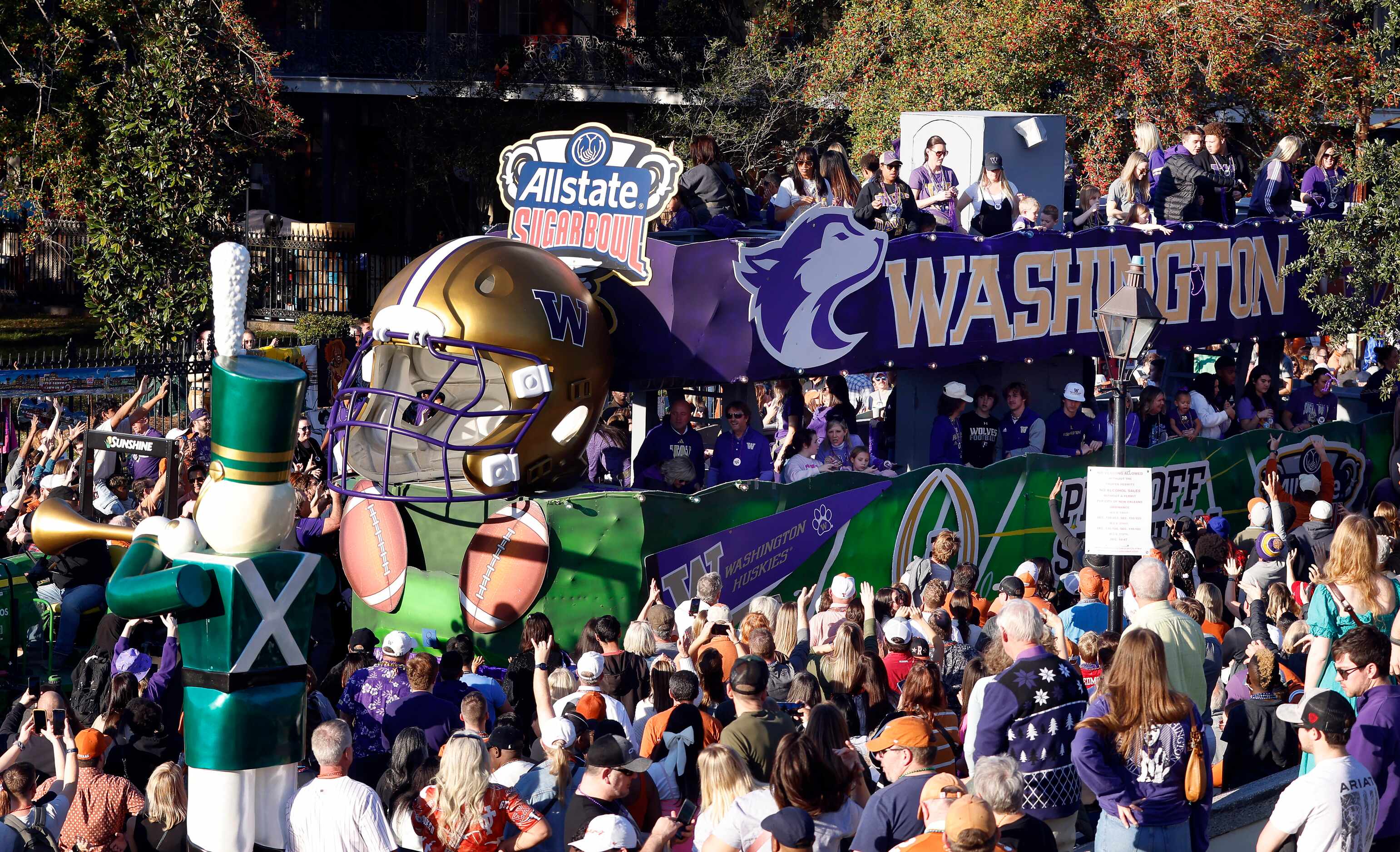 The Washington Huskies float rolls down Decatur St during the Mardi Gras-style Allstate...