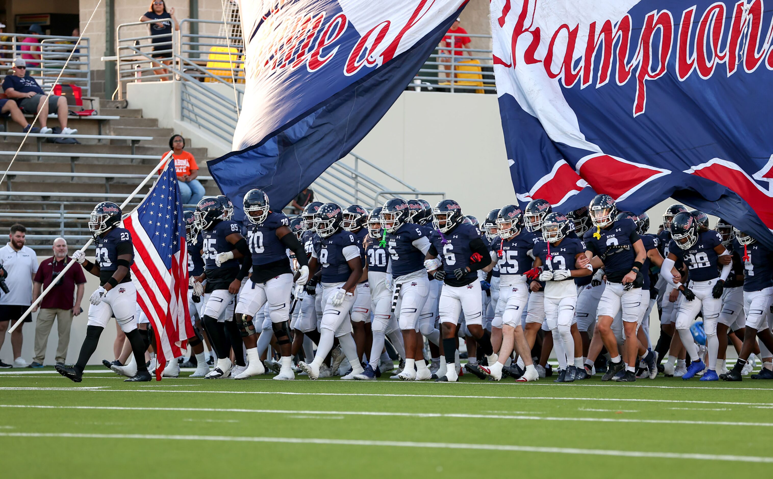 The Denton Ryan Raiders enter the field to face Mansfield Timberview in a high school...