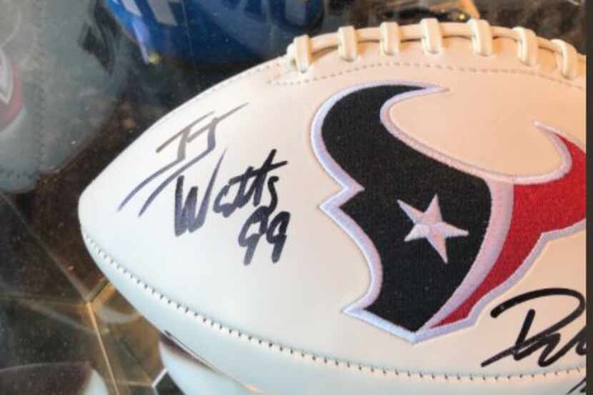 There's something a little off about this football purported to be signed by Houston Texans...