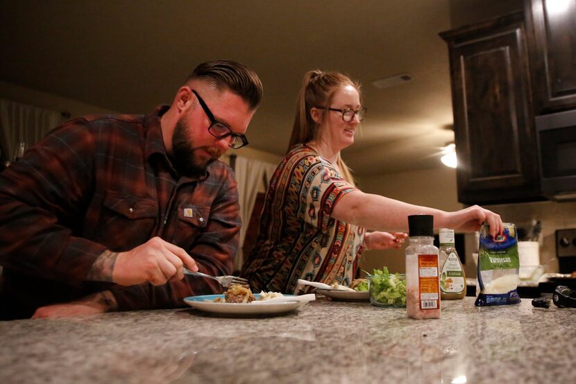 Edward Huth, a Marine veteran and federal corrections officer, eats dinner with his wife,...