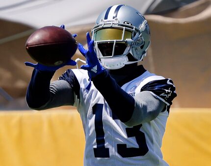 Dallas Cowboys wide receiver Michael Gallup (13) catches a pass from quarterback Dak...