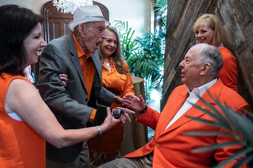 Jim Moeller, left, greets T. Boone Pickens.  They went to junior high together in...
