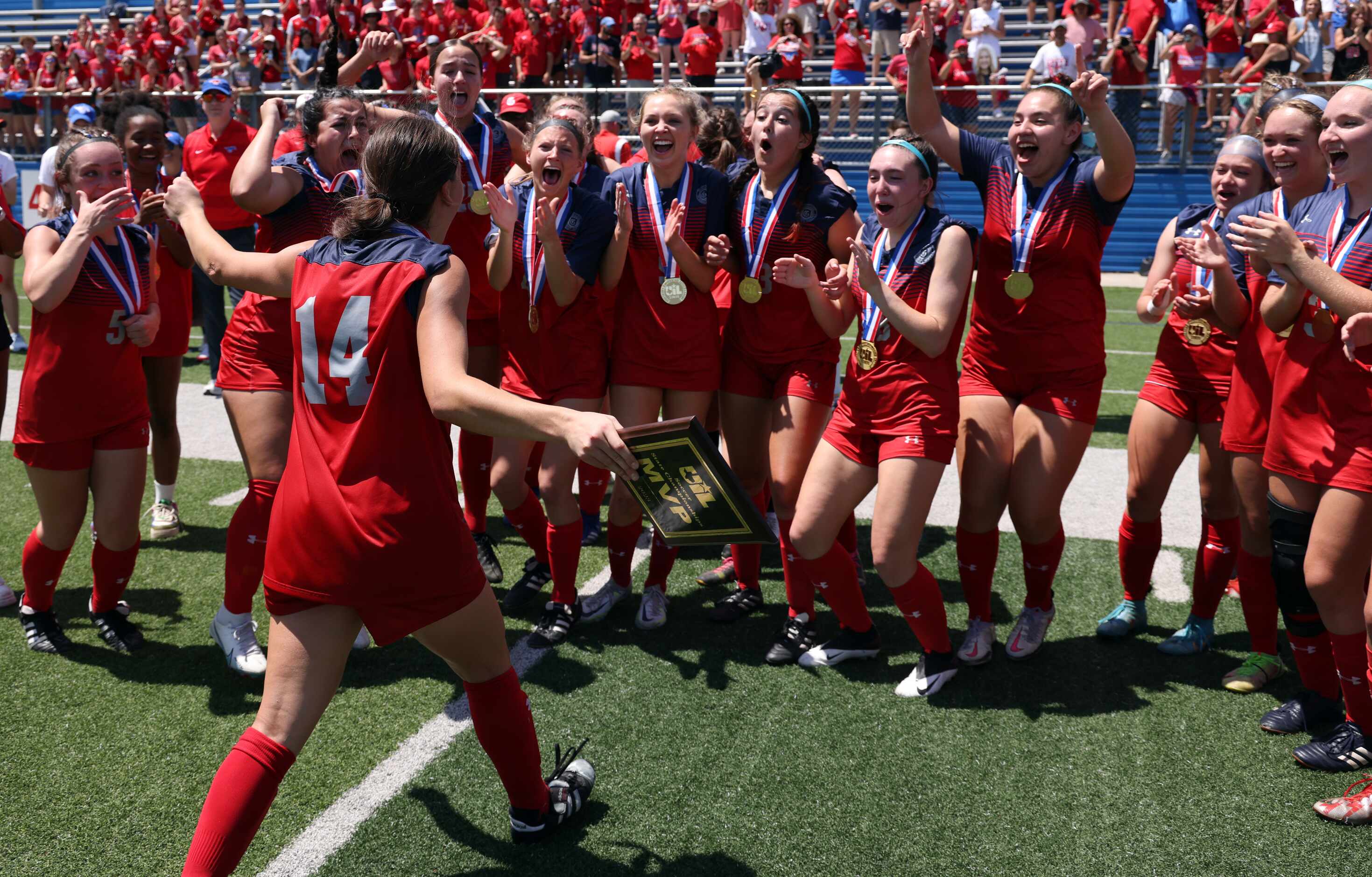 Grapevine forward Theresa McCullough (14) is congratulated by teammates after being named...