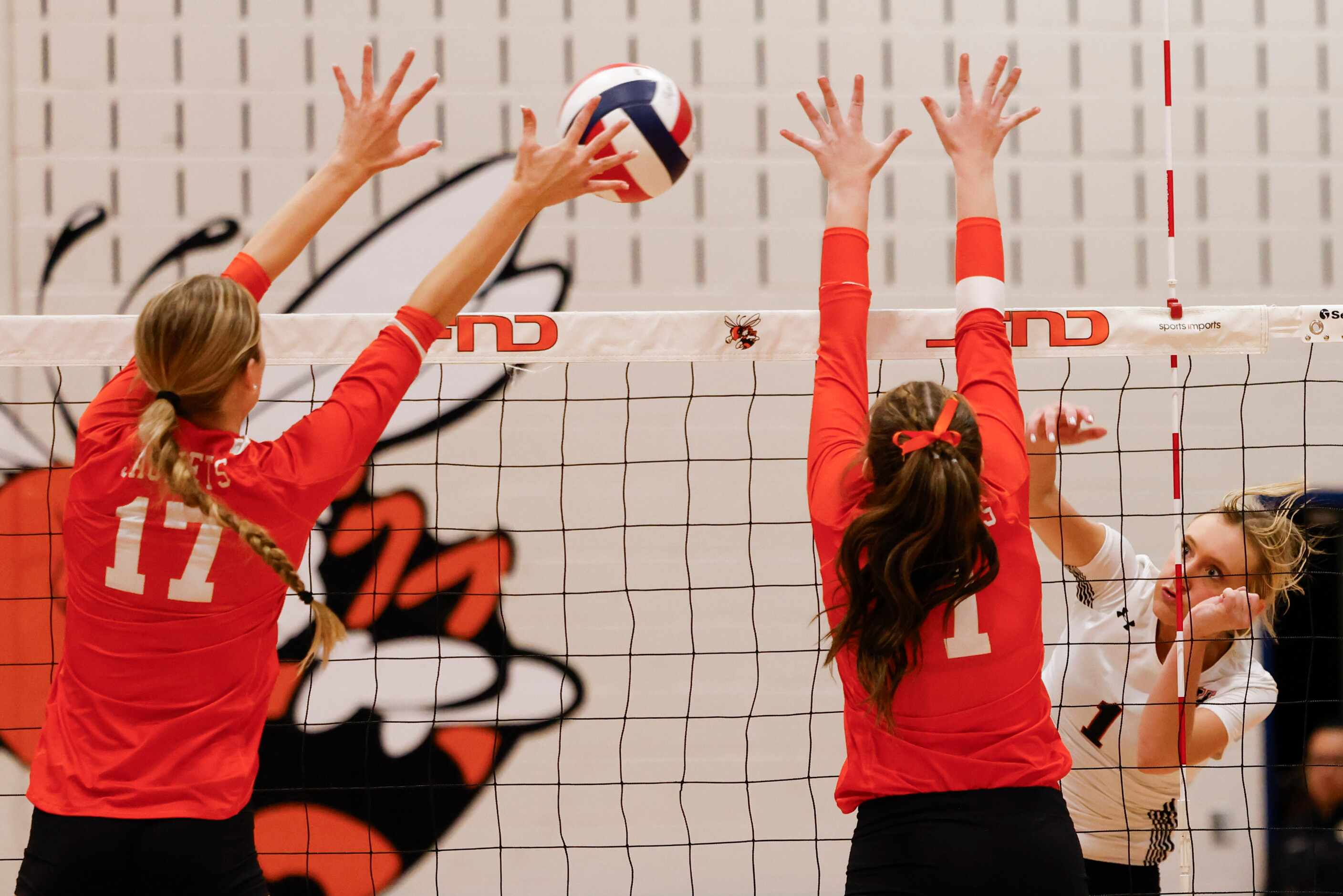 Rockwall high’s Sydney Lafferty (left) and Gabi Ashcraft (center) defends against Rockwell...