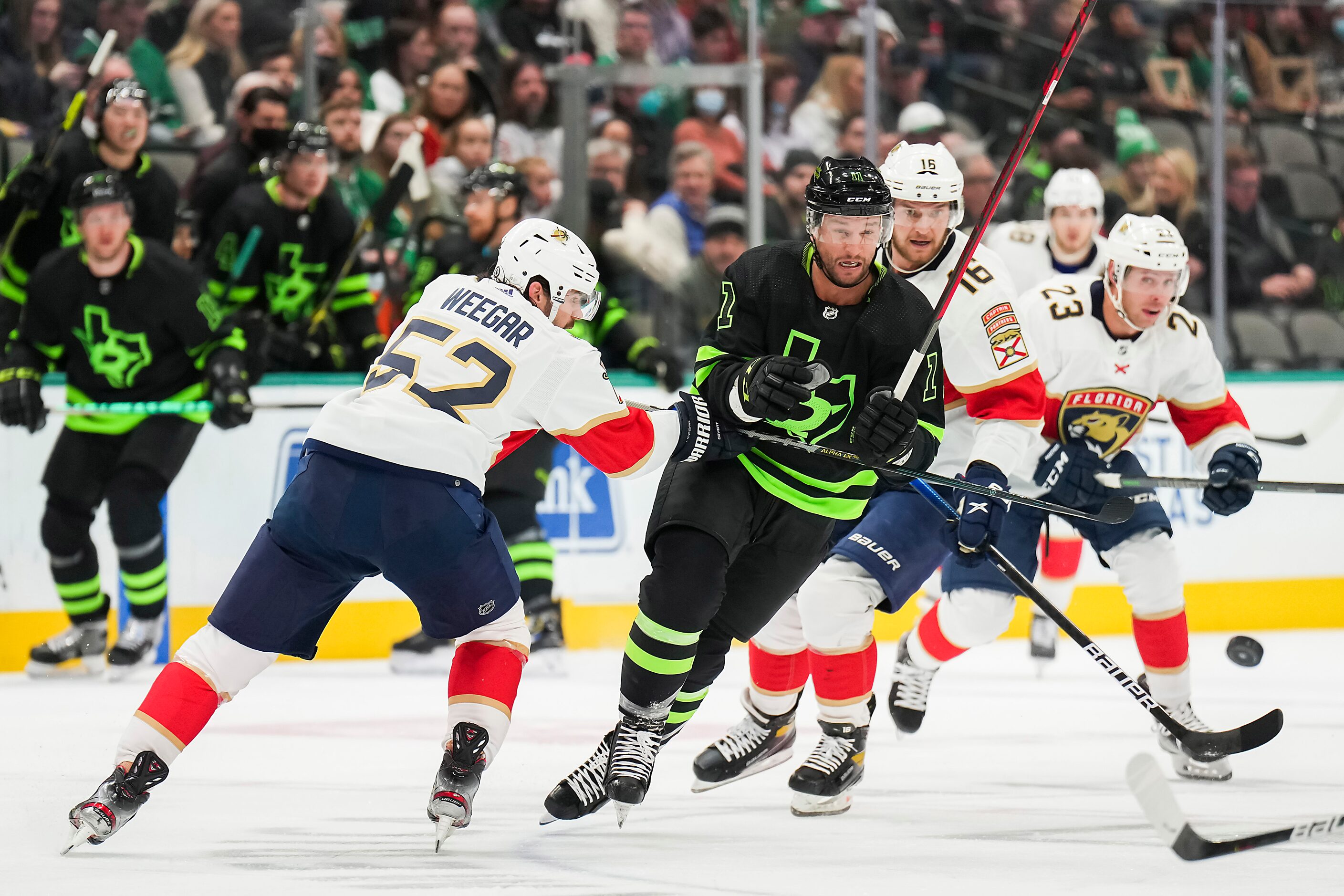 Dallas Stars center Luke Glendening (11) pushes through Florida Panthers defenseman...