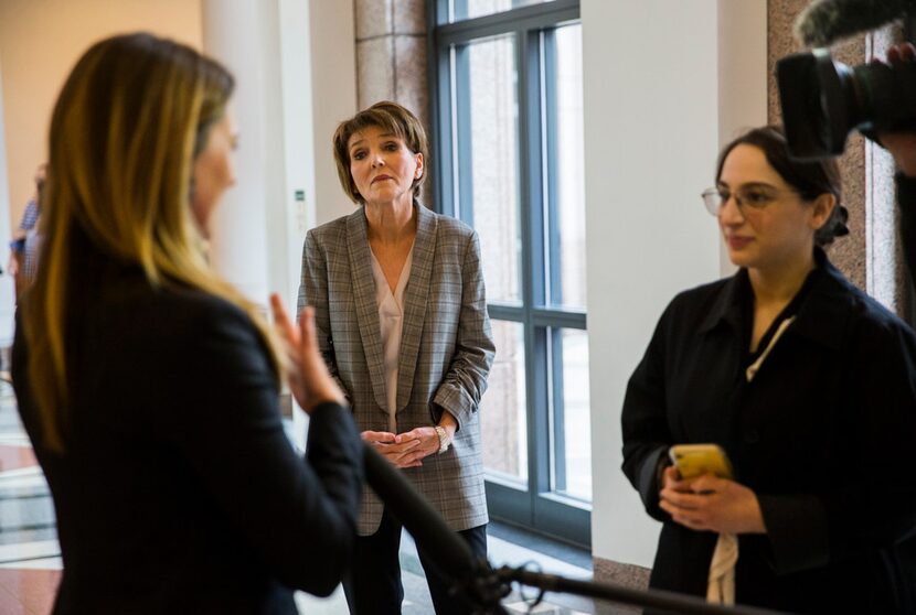 Eve Wiley (left) and her mother, Margo Williams (center), talked to reporters in the Capitol...