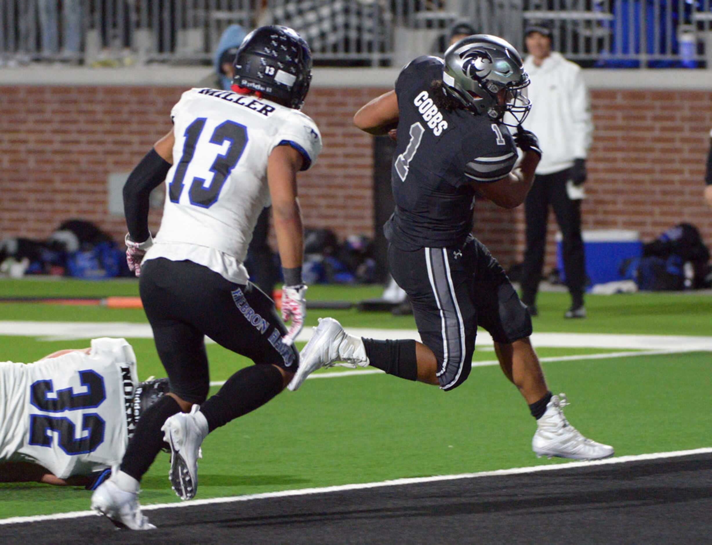 Guyer's Kaedric Cobbs runs in for a second half of a Class 6A Division II bi-district high...