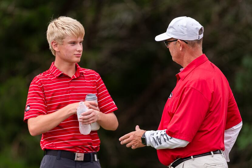 Colleyville Heritage golf coach Gerald Brown, right, speaks with Kevin Watts on the 2nd tee...