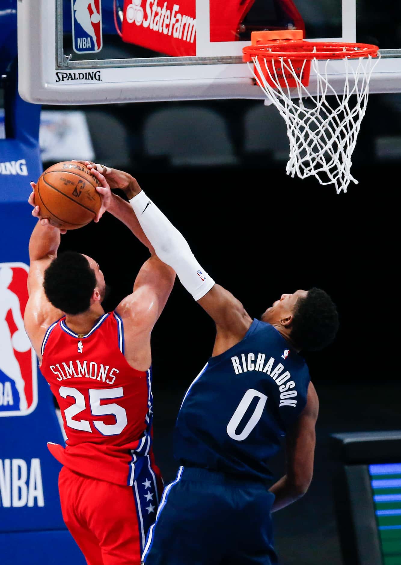 Philadelphia 76ers guard Ben Simmons (25) attempts a shot as Dallas Mavericks guard Josh...