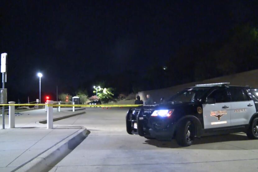 Police investigate the aftermath of a fatal shooting at TRE's Centreport/DFW Airport station...