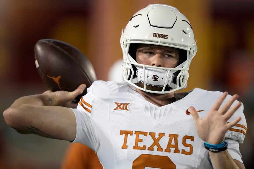 Texas quarterback Quinn Ewers warms up before an NCAA college football game against Iowa...