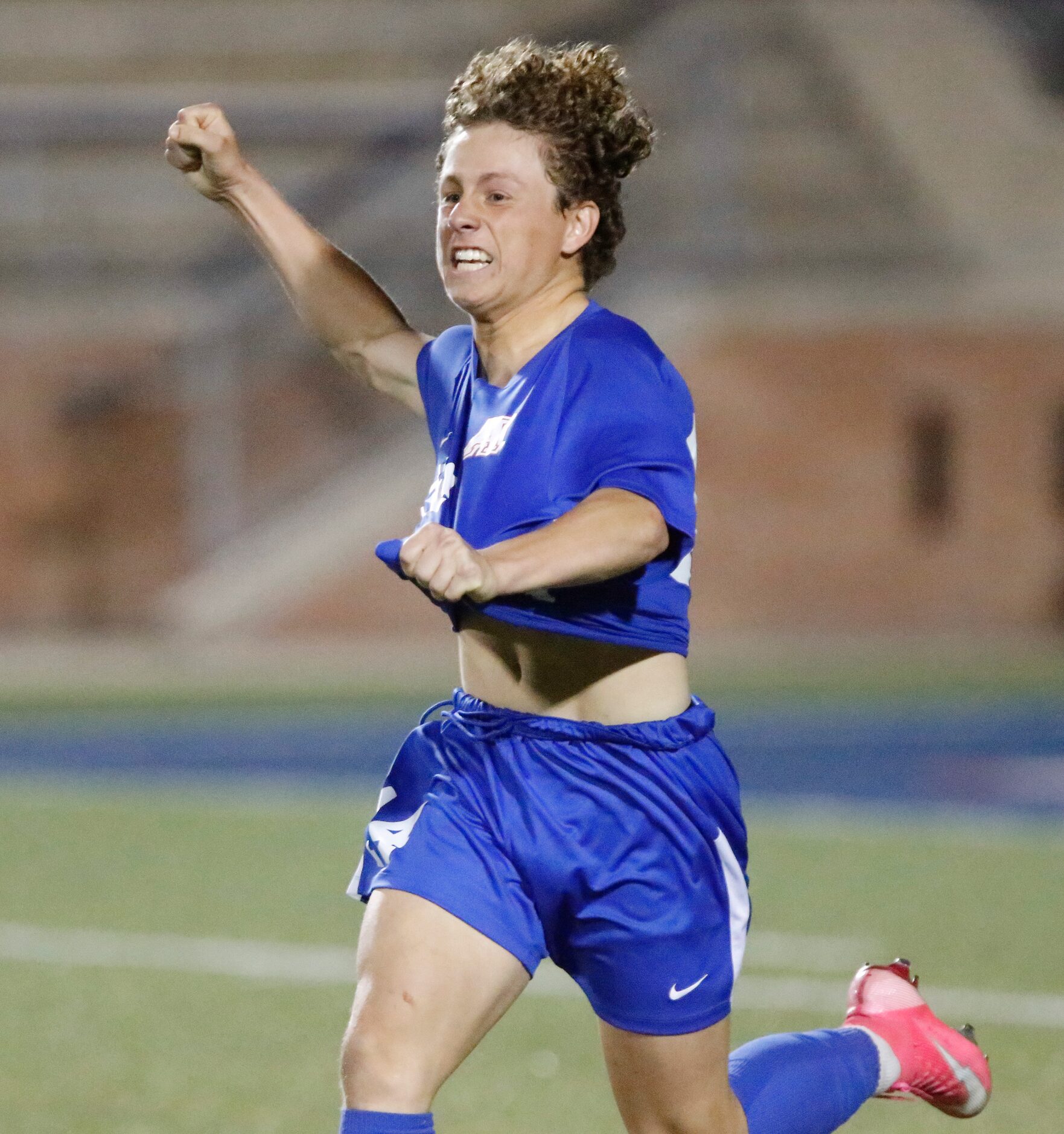 Allen forward Matthew Sanchez (14) celebrates making his penalty kick to secure victory in a...