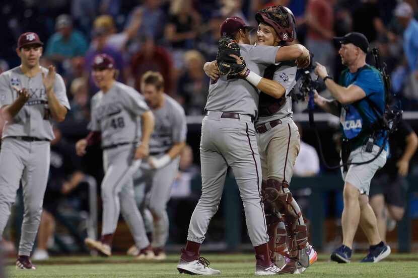 Texas A&M pitcher Josh Stewart (34) and catcher Jackson Appel (20) celebrate their 5-1 win...