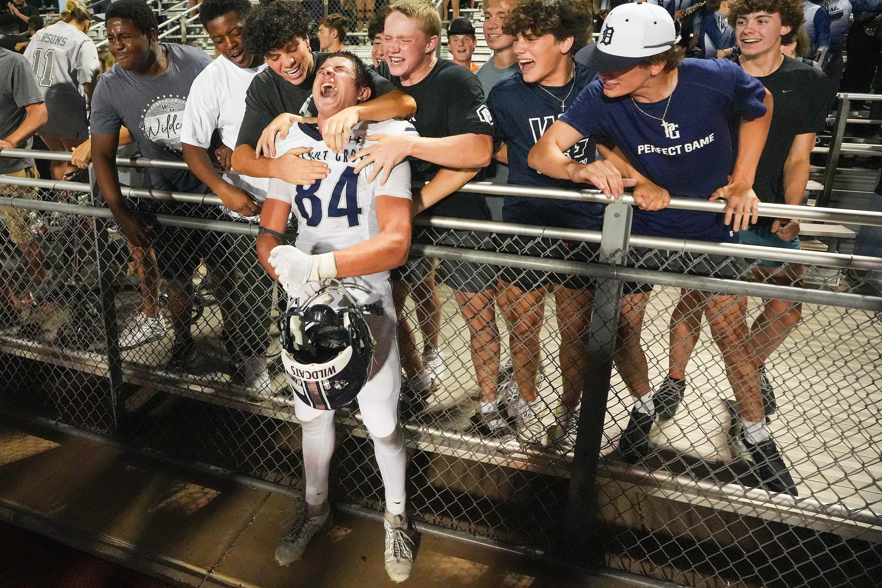 Prosper Walnut Grove wide receiver Hayden Cooley (84) celebrates with fans after a 29-28...