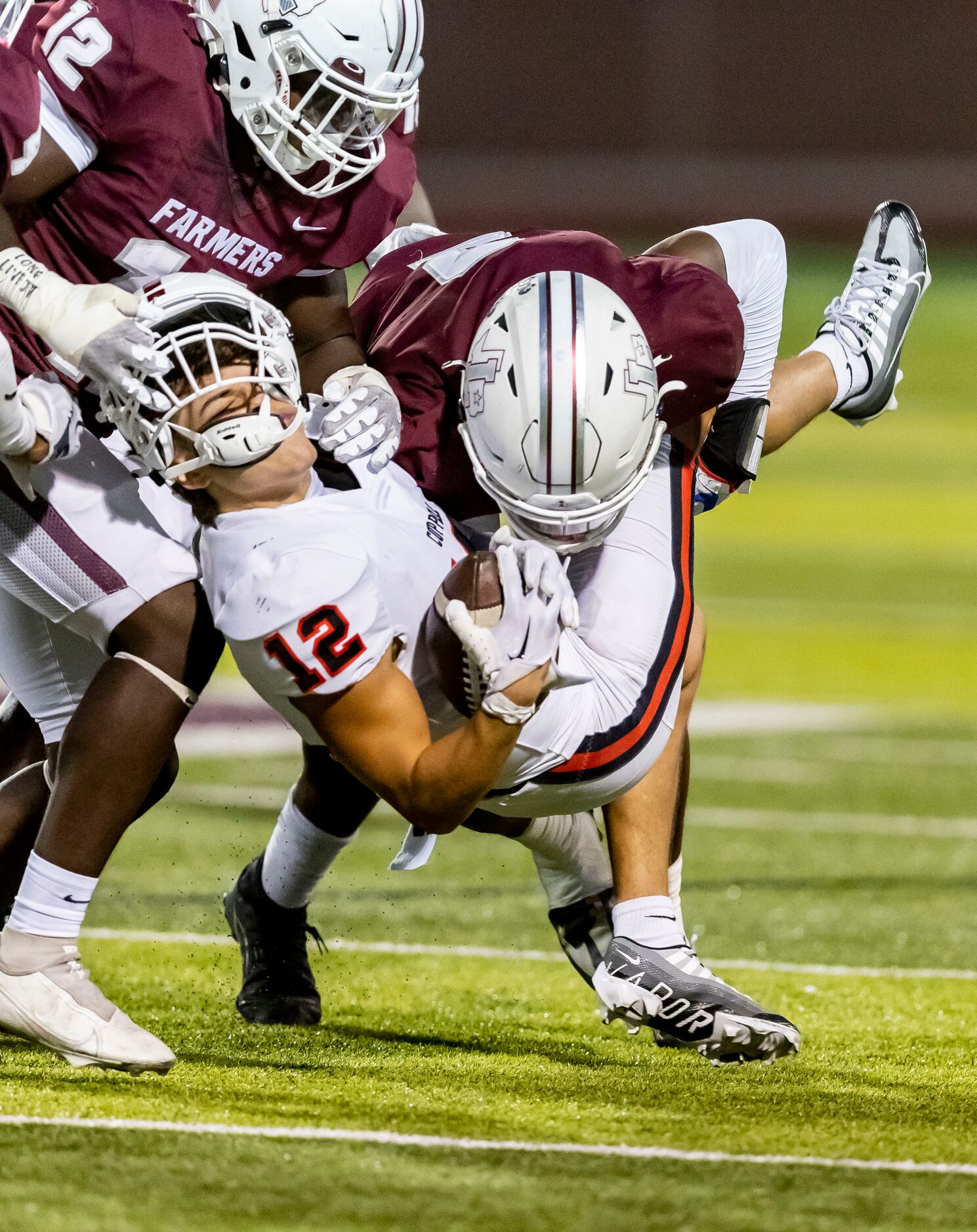 Lewisville senior defensive back Cameren Jenkins (2) tackles Coppell junior wide receiver...