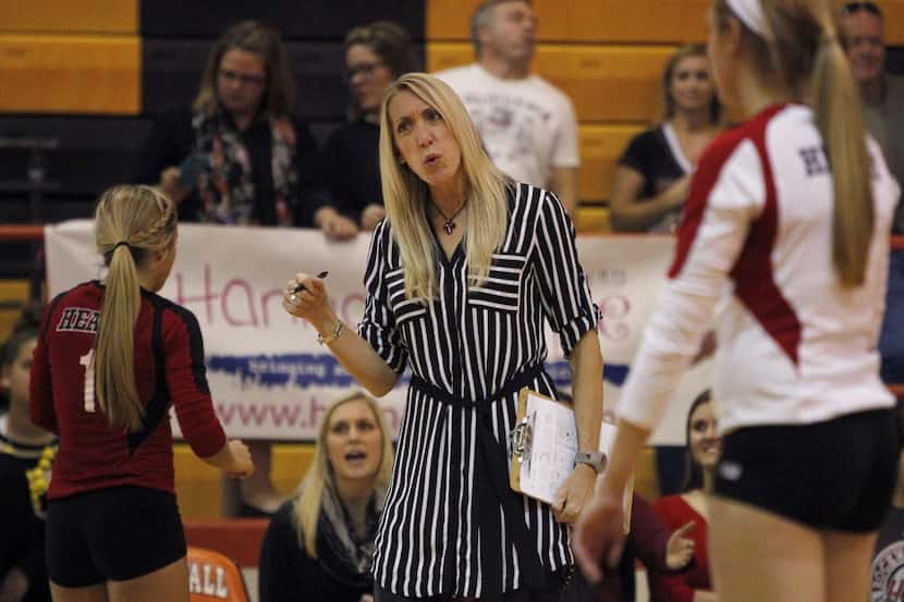 Rockwall Heath Hawks head coach Maggie Younger talks to her squad during high school...