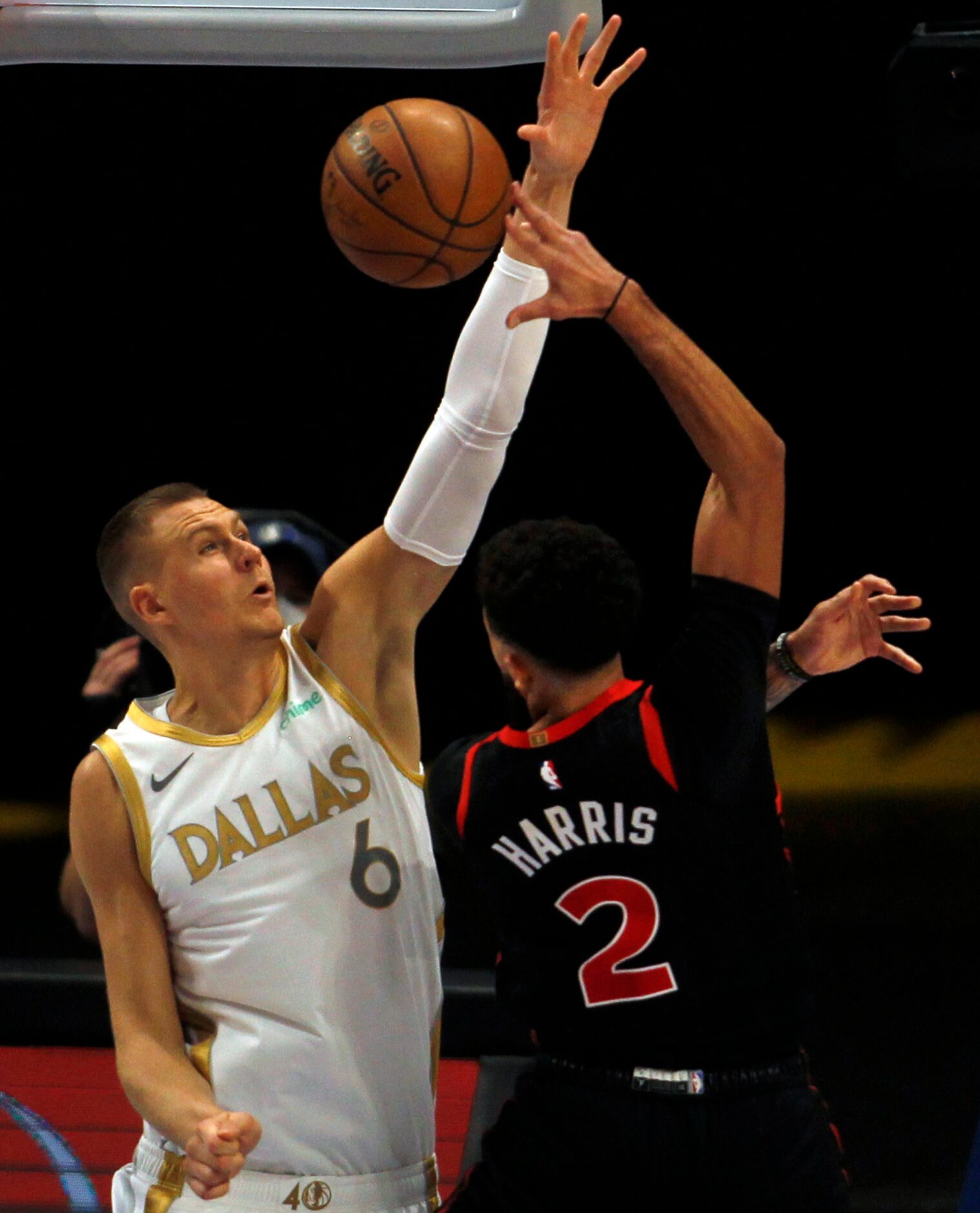 Dallas Mavericks center Kristaps Porzingas (6) presents a defensive challenge for Toronto...