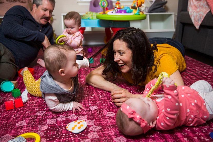 Actress Allison Pistorius (right) and her husband, actor Chris Hury, play with their...