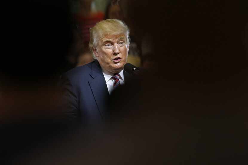 Republican presidential candidate Donald Trump is seen past attendees as he speaks during a...