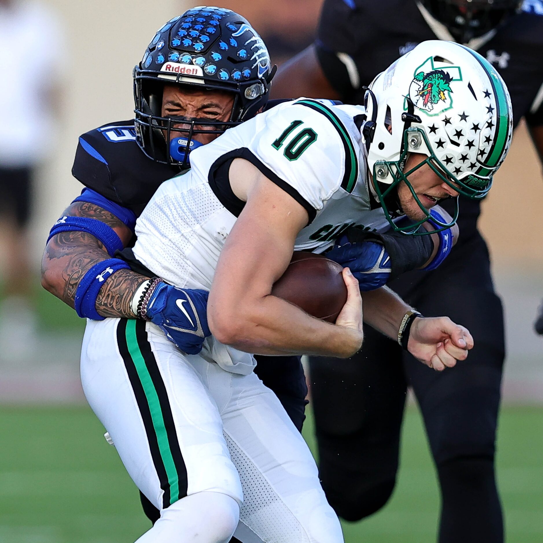 Byron Nelson linebacker Jaeden Bland (13) sacks Southlake Carroll quarterback Graham Knowles...