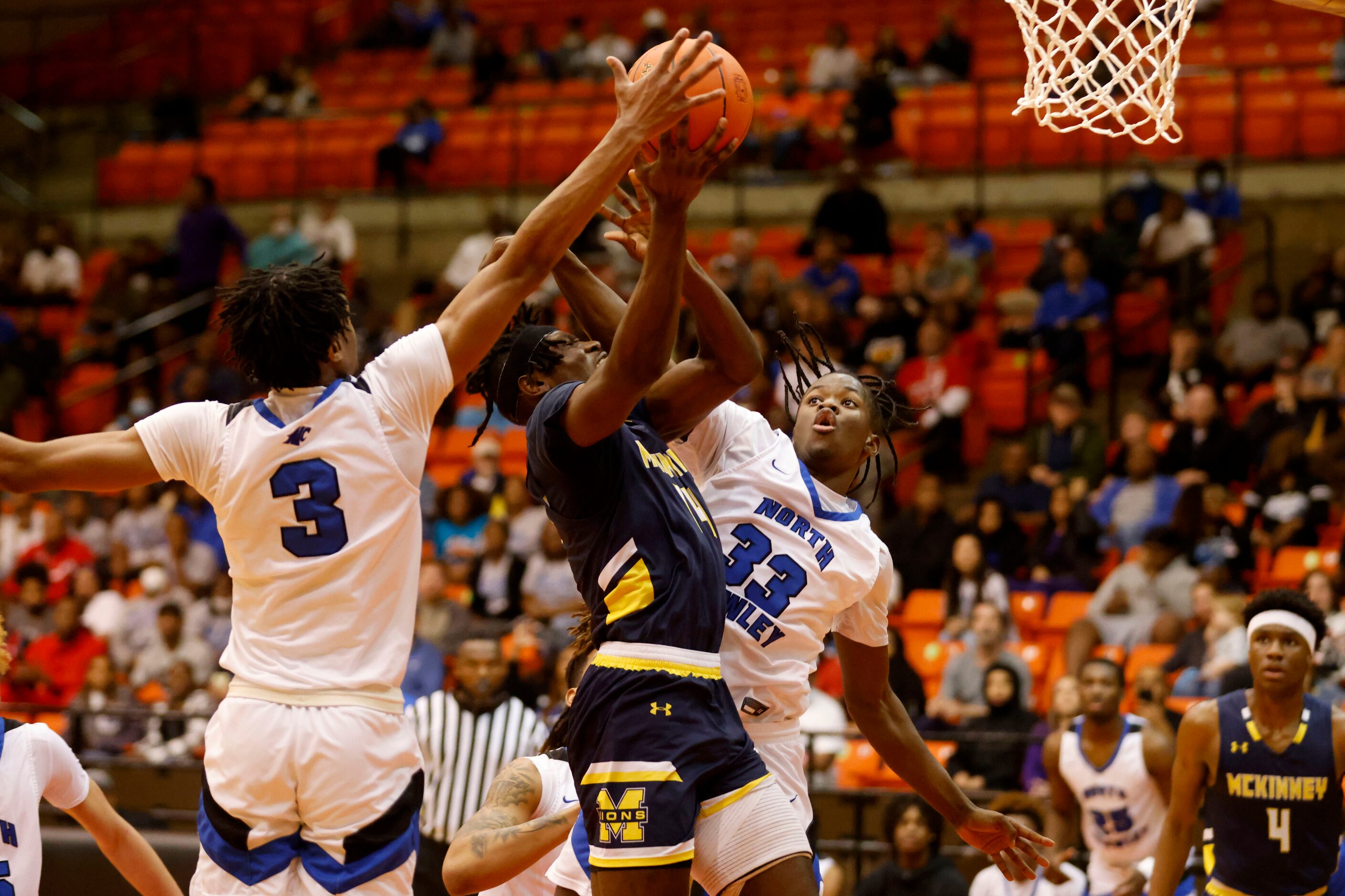 McKinney’s Ale Anamekwe (14) is fouled as he is defended by North Crowley’s Trey Davis (3)...