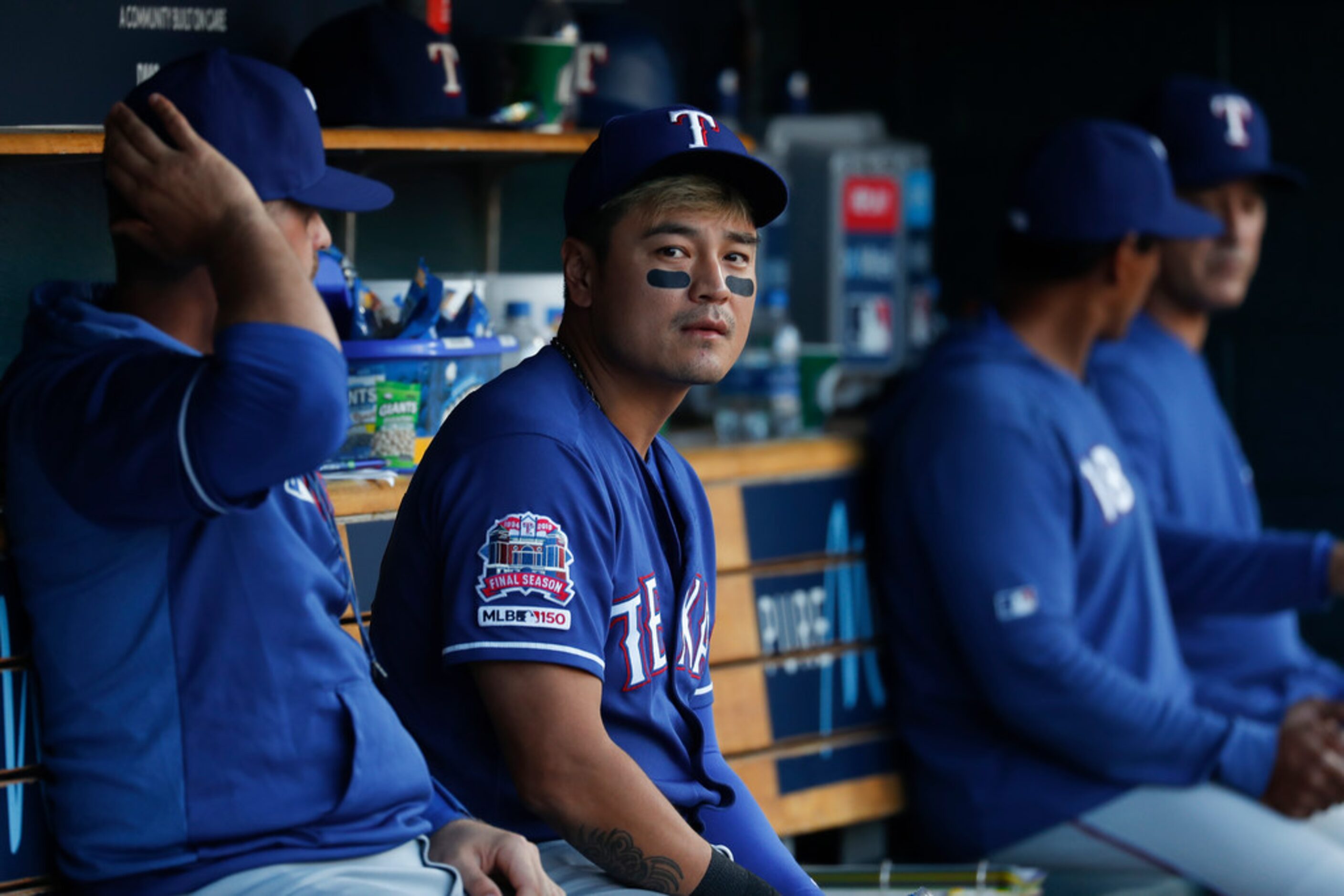 Texas Rangers' Shin-Soo Choo watches from the dugout in the fourth inning of a baseball game...