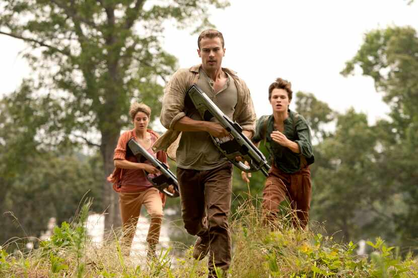 In this image released by Lionsgate, Theo James, center, Shailene Woodley and Ansel Elgort...