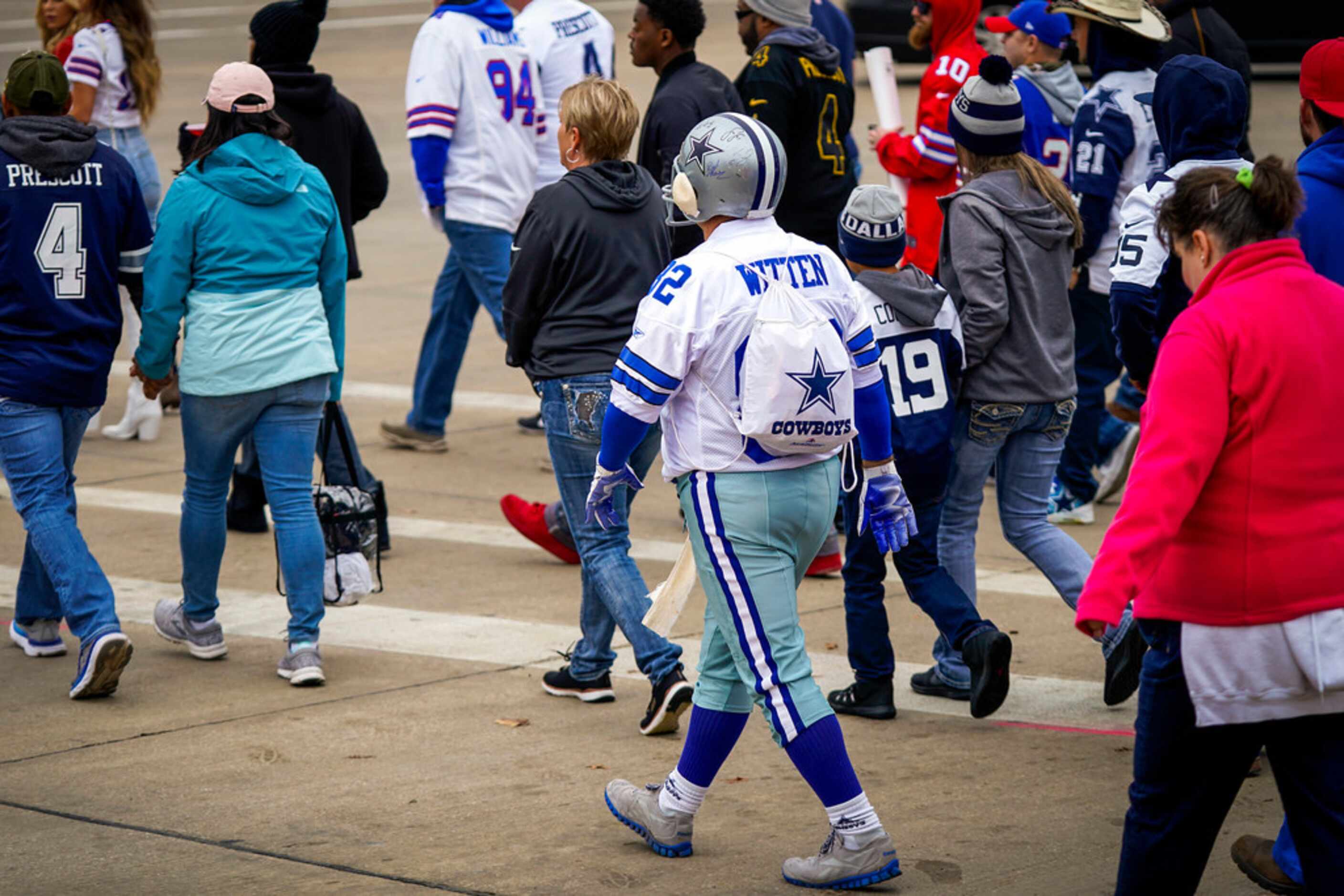 Dallas Cowboys Mark Wilhite of Amarillo heads to the stadium as fans tailgate before an NFL...
