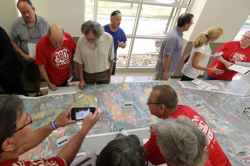 Residents and TxDOT representatives discuss plans to expand and improve U.S. Highway 380 at...