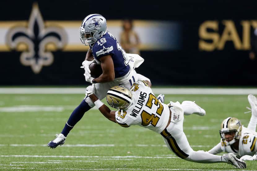 Dallas Cowboys wide receiver Randall Cobb (18) is tackled by New Orleans Saints free safety...