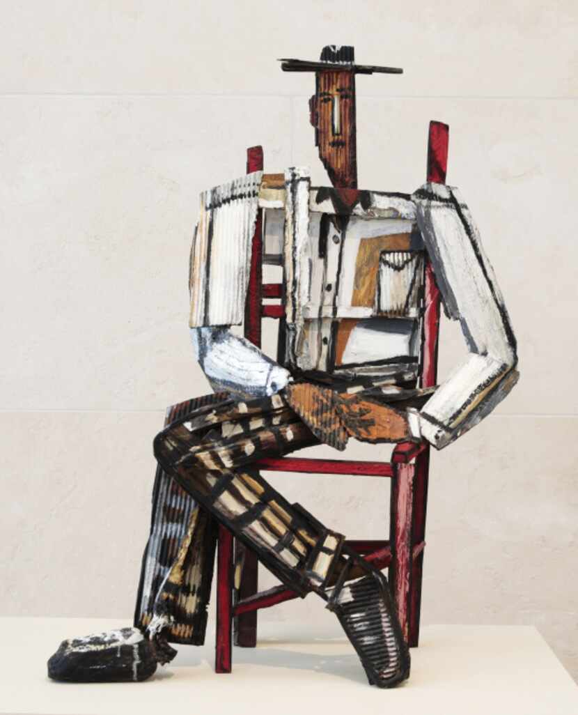 This painted bronze titled, "Man in Red Chair", 1994, is on display at the Nasher Sculpture...