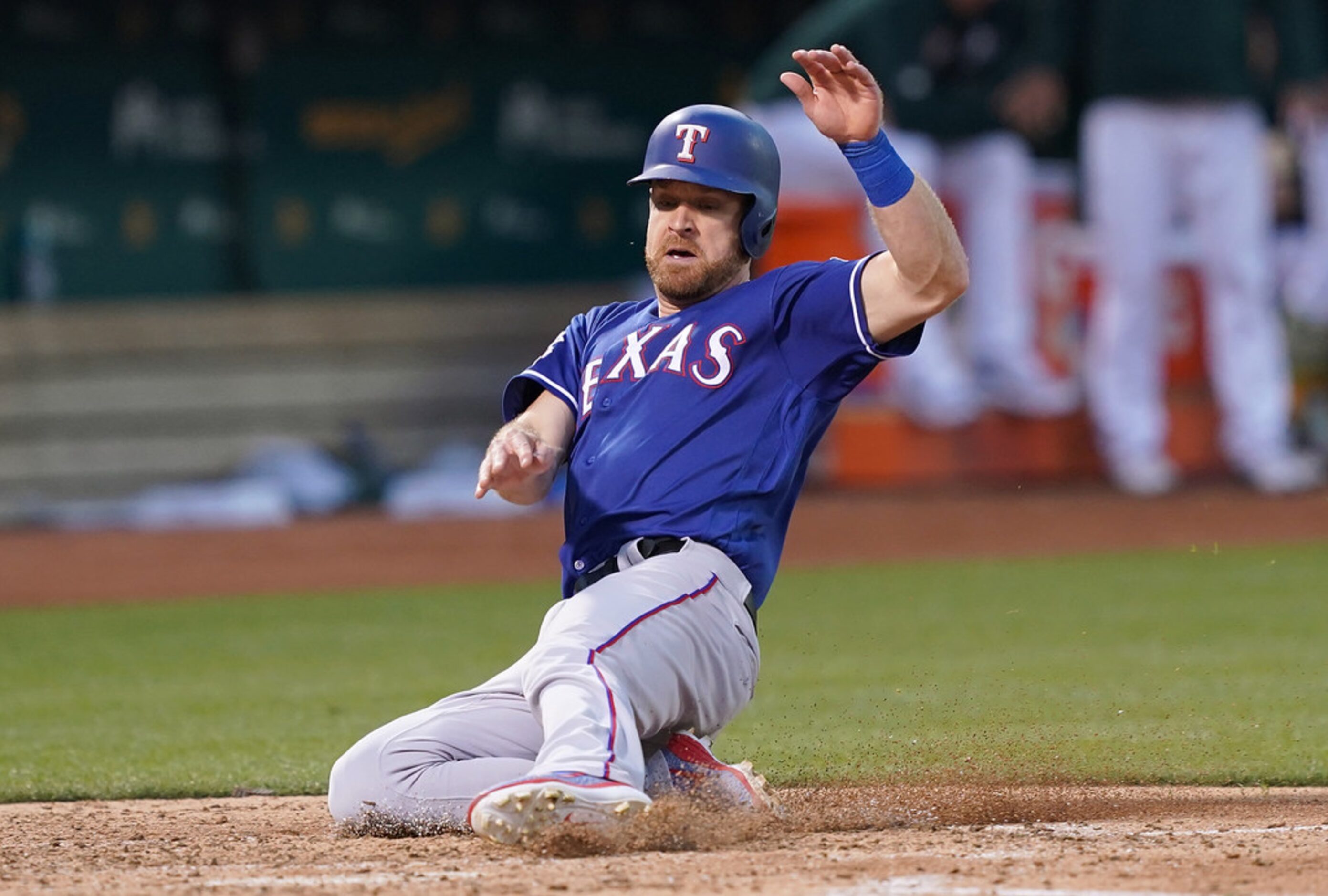 OAKLAND, CA - JULY 25:  Logan Forsythe #41 of the Texas Rangers scores against the Oakland...