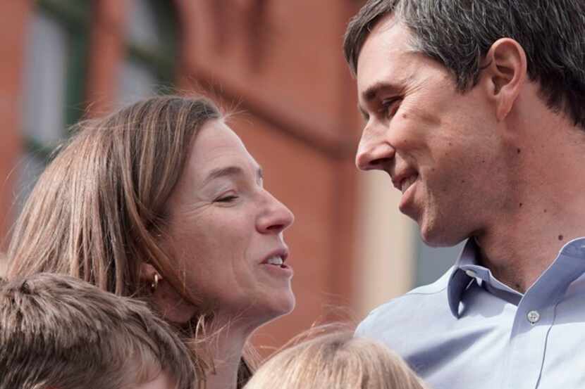 Former Texas Congressman Beto ORourke is pictured on stage with his wife, Amy O'Rourke, and...