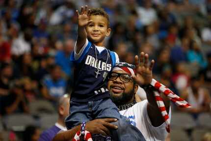 Mavs ManiAAC Randy Thornton, known as "Wild Dog," held his son, Jackson Emmanuel Thornton,...