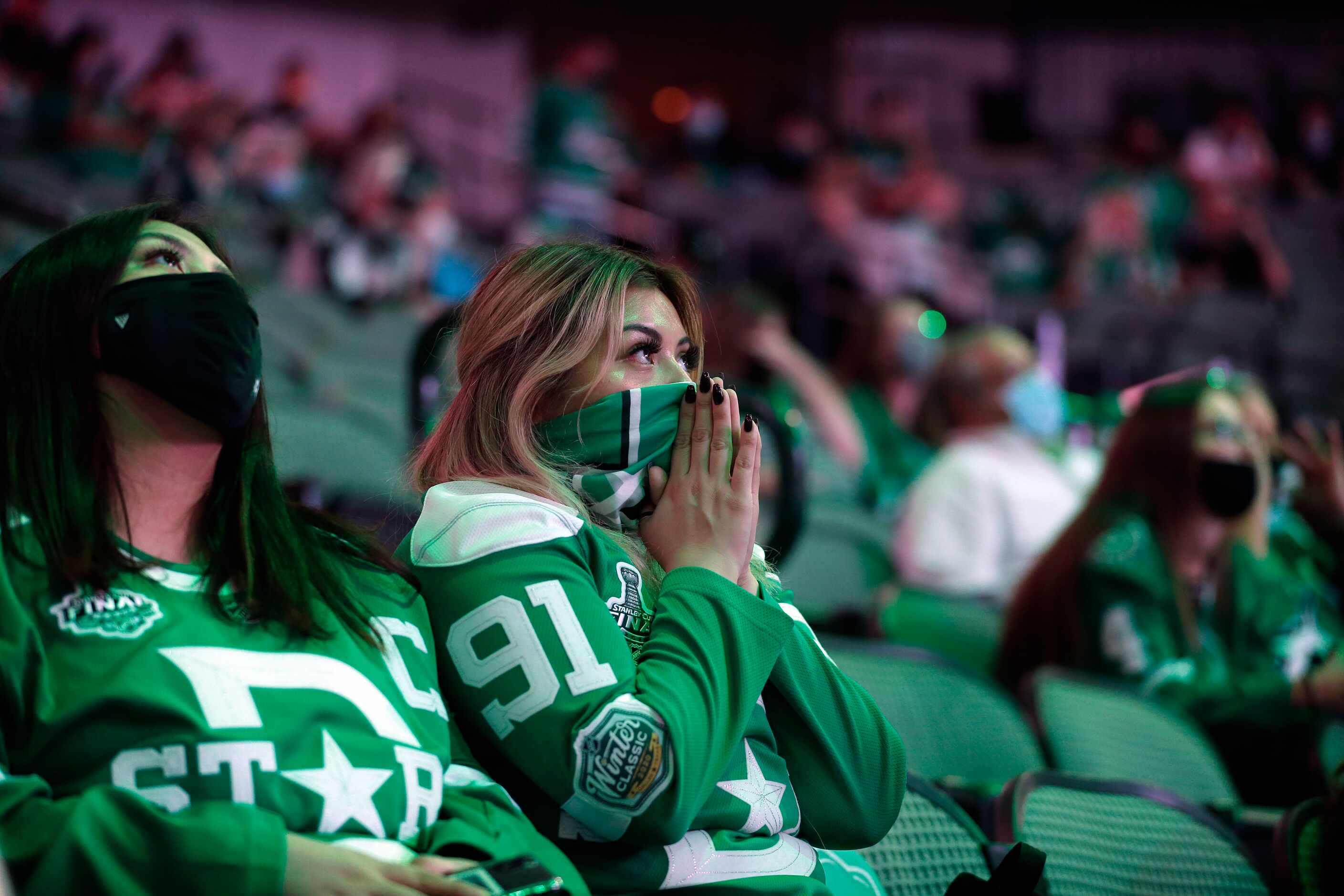 Dallas Stars fan Nady Zacapala of Fort Worth reacts as Tampa Bay scores a third period goal...