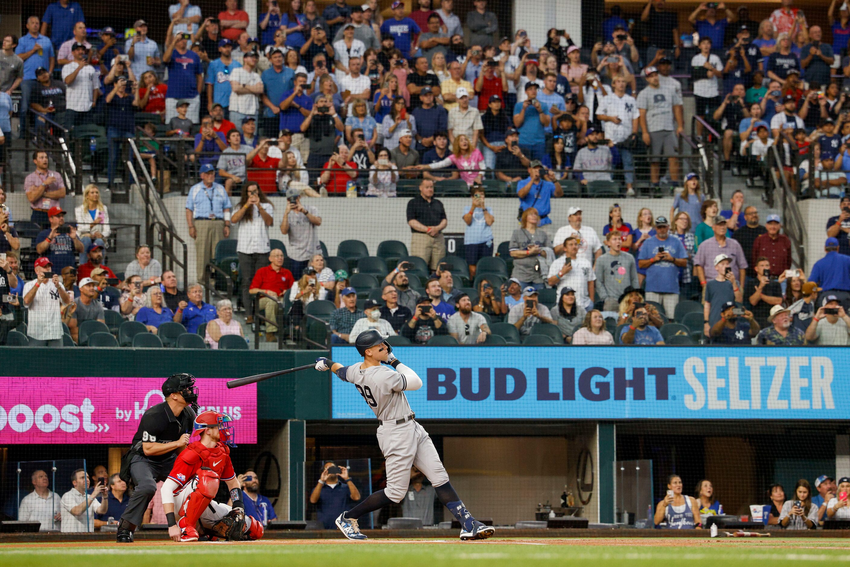 New York Yankees right fielder Aaron Judge (99) hits a home run to left field off Texas...