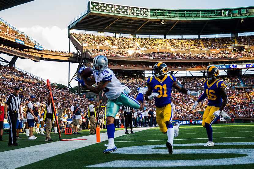 Dallas Cowboys wide receiver Devin Smith (15) catches a pass in the end zone for a touchdown...