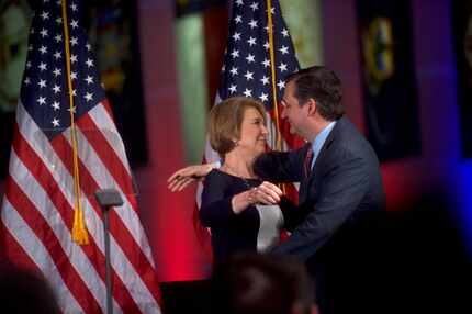  Sen. Ted Cruz hugs Carly Fiorina at a campaign event at the National Constitution Center in...
