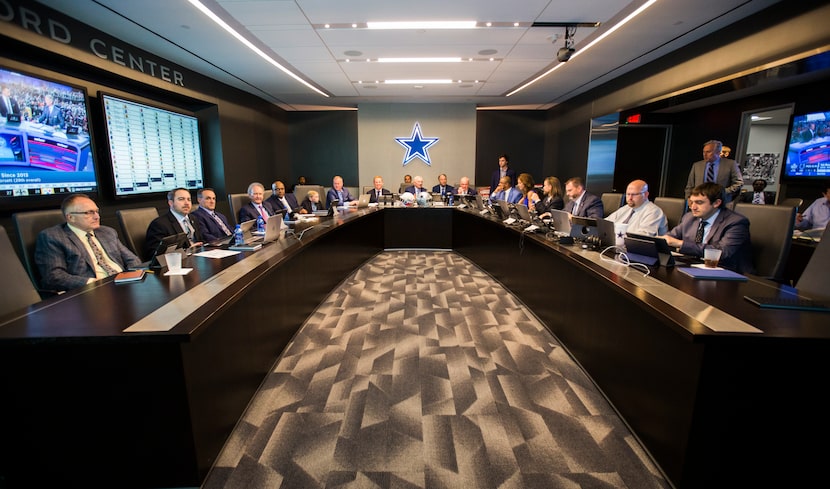 FILE - Cowboys owner Jerry Jones (center), then-head coach Jason Garrett (center-left),...